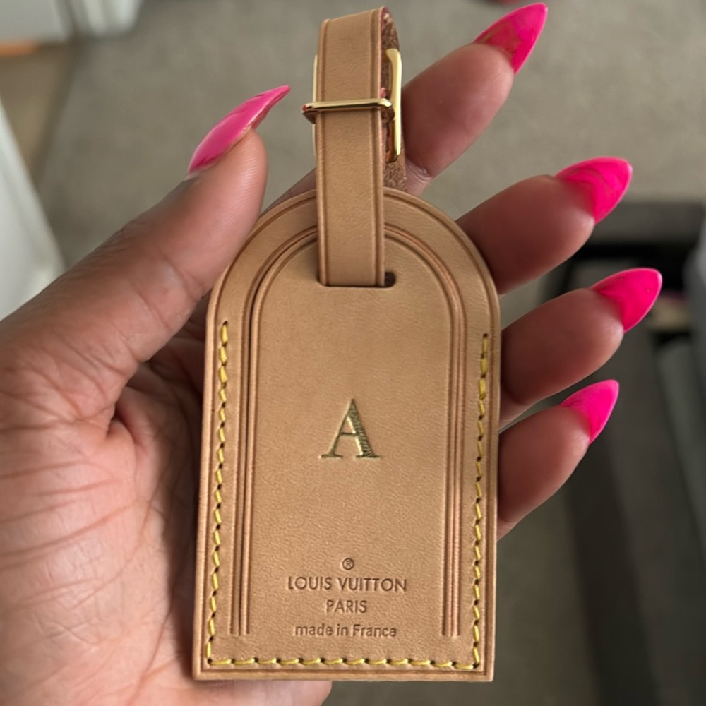 Brand new authentic Louis Vuitton luggage tag